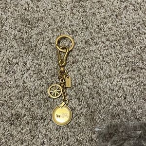 Coach gold keychain.